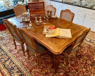 French Parquet top dining table with two leaves and 8 matching caned chairs
Table 60” x 43.5”
Leaves add 22” each