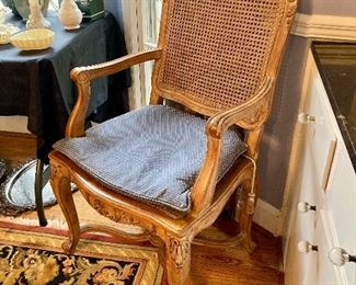 Caned French dining chairs (sold with the table). 