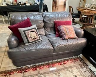 Matching gray leather love seat
60” w, 38” d, 30” h
