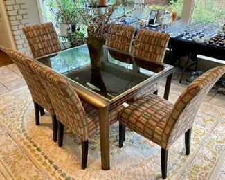 Expanding contemporary dining table by DIA (Design Institute of America) w/ smoked glass top , bronze finish with polished brass details.
52” w, 42” d, 30” h
Extends to 104” w with leaf

