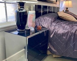 Pair of black mirror and chrome nightstands with matching king headboard 25” H. 25” W. 17” D

Headboard - $400
