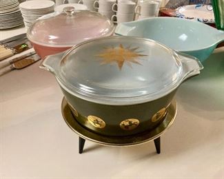 Pyrex Zodiac casserole dish with star lid and footed base
