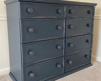 SOLD- Distressed navy blue dresser with 8 drawers. No manufacturing label present. Great condition! (Color is slightly darker than shown.)44" L x 17" W x 36" H. 