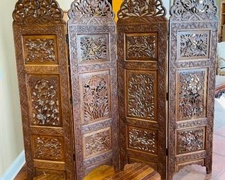 The carving is so intricate and detailed! This Ornate Carved Wood Room Divider that measures 71x80 inches. There is some vintage wear including cracks from age. 