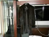 in Size 10-12, this is a dark ranch Female skin mink coat.