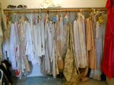 huge closet full of draperies and lace panel curtains
