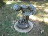 one of the bronze statues in the backyard.
