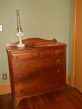 cherry chest of drawers and Aladin oil lamp