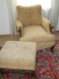 carved arm chair with foot stool, does not match, but is upholstered the same, so we made them a set