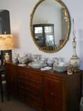 buffet to the dining room set with vintage round mirror and set of china