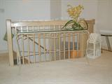 another glass and iron sofa/console table