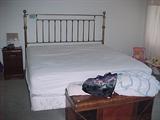 King Sized bed with fancy headboard
