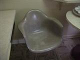 one of three Eames molded fiberglass arm chairs