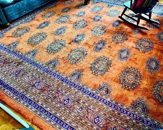 Nice colors!  Large Pakistan  Bokhara 9'16"x12'10".  The orange and blue really sets off this library adding some masculinity to any room.