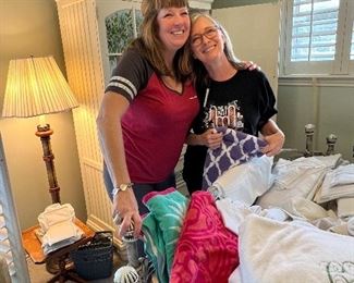 Dawn and Christi folding tons of linens!