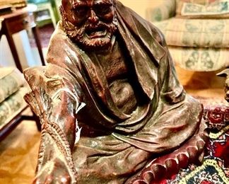 Antique Chinese immortal bronze on stand.  Nice detail.