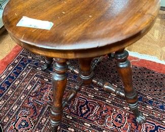 Throw in an antique piano stool with ball and claw feet...why not?