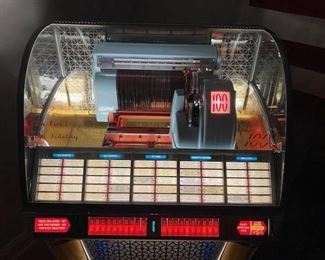 1953 Seeburg 100g Jukebox. New Chrome, new glass, new wood veneer.  Amazing restoration, plays great, fantastic sound.  Looks like it just came out of the factory.  Full of 45's! 1953 Seeburg 100g lovingly restored to showroom condition. Plays and operates great. Original speaker fills the room. All chrome professionally redone. Veneer redone to match original specs. Brand new glass dome topper with authentic decals. Holds 50 records for 100 plays. Sounds as great as it looks. A real showstopper for any home lounge or entertainment room. PRESALE IS OFFERED ON THIS JUKEBOX TREASURE! Contact us at lottstreasures@gmail.com