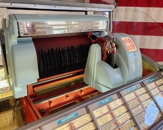 1953 Seeburg 100g Jukebox. New Chrome, new glass, new wood veneer.  Amazing restoration, plays great, fantastic sound.  Looks like it just came out of the factory.  Full of 45's! 1953 Seeburg 100g lovingly restored to showroom condition. Plays and operates great. Original speaker fills the room. All chrome professionally redone. Veneer redone to match original specs. Brand new glass dome topper with authentic decals. Holds 50 records for 100 plays. Sounds as great as it looks. A real showstopper for any home lounge or entertainment room. PRESALE IS OFFERED ON THIS JUKEBOX TREASURE! Contact us at lottstreasures@gmail.com