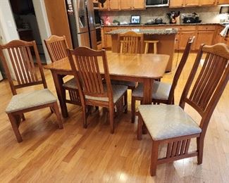 Wood dining/kitchen table also has 2 extra leaves.