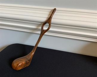 Golf shaped wine holder.