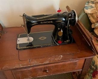 Singer sewing machine in stow away cabinet 
