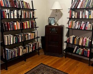 Book collection includes biographies, self help, cook books, travel, reference and more. Book shelves pictured also for sale