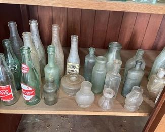 some soda bottles, ink wells, medicine bottles