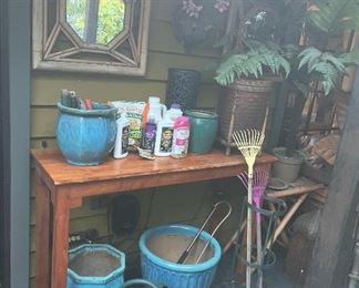 assorted gardening supplies and pottery