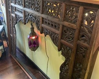 carved wall divider with lantern