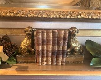 Antique foo dogs and leather bound books