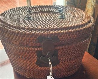 Tightly woven basket with brass accents