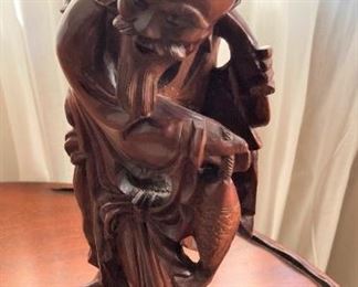 Carefully carved Asian figure