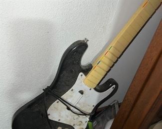 scruffy guitar hiding in basement.. $50