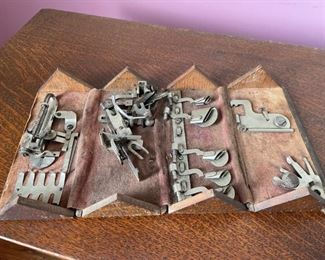 Antique small wooden box with an interesting opening system. Contains accessories for the Wheeler & Wilson 
sewing machine.