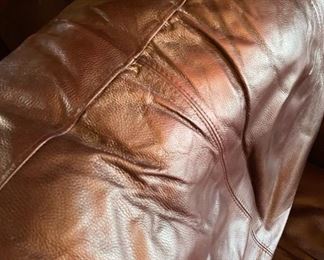 Serta brown leather stuffed chair - Chair: 34"h x 43"w x 37"d. Ottoman 13"h x 27"w x 23"d. Available for pre-sale starting 1/9/23. Text 615-854-8535 for more information and/or to arrange a time to view. Take a look at matching loveseat & couch!