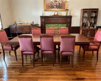Landstrom Furniture Art deco 60-inch dining table with 3 - 11 inch leaves.  Six dining chairs and and two captains chairs apholstered in mauve/dusty rose pattern with green accent.  Has matching hutch and buffet. Available for pre-sale starting 1/9/23. Text 615-854-8535 for more information and/or to arrange a time to view.