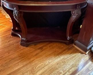 Curved wooden sofa table with glass top. 51.5"w x 27"h x 17.5"d. (Has matching coffee table and side tables.) Available for pre-sale starting 1/9/23. Text 615-854-8535 for more information and/or to arrange a time to view.