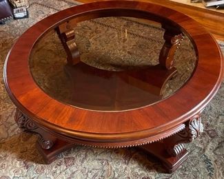 Round wooden coffee table with glass top. 40" diameter x 18" height.  (Has matching side tables and sofa table) Available for pre-sale starting 1/9/23. Text 615-854-8535 for more information and/or to arrange a time to view.