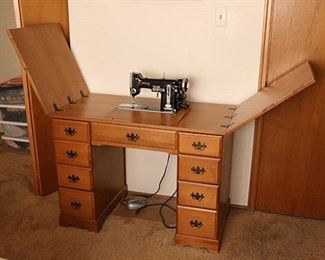 sewing machine in a wood cabinet