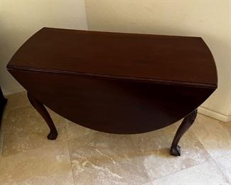 1800s Cherrywood dropleaf table	Table leaves expanded 52 inches long 42 inches wide, 27.25 inches tall. Leaves collapsed 18 inches wide.	
