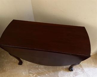 1800s Cherrywood dropleaf table	Table leaves expanded 52 inches long 42 inches wide, 27.25 inches tall. Leaves collapsed 18 inches wide.	
