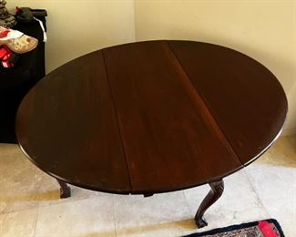 1800s Cherrywood dropleaf table	Table leaves expanded 52 inches long 42 inches wide, 27.25 inches tall. Leaves collapsed 18 inches wide.	
