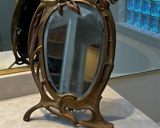 Art Deco solid brass mirror	17 inches tall 11 inches wide 6 inches deep	
