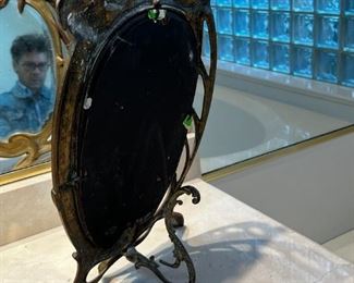 Art Deco solid brass mirror	17 inches tall 11 inches wide 6 inches deep	
