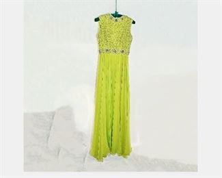 Mid century (c1964) vibrantly colorful and romantic ball gown made of chartreuse green chiffon.