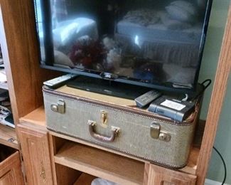Flat screen television vintage luggage