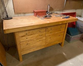 Work table 5' by 26" deep, 33" tall with a vice