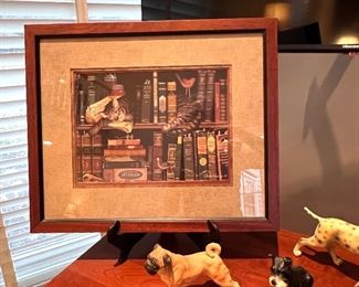 Picture of cat sleeping in on book shelf 