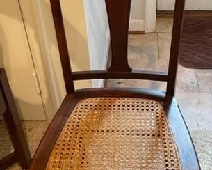 Cherry wood cane-seat chair.